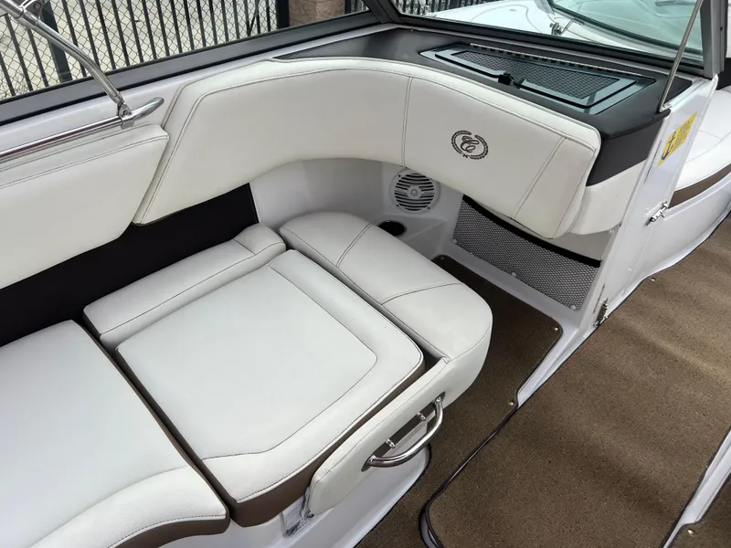 Slide: The Image of Interior seating of a 2017 Cobalt 220S boat with white upholstery. - 14