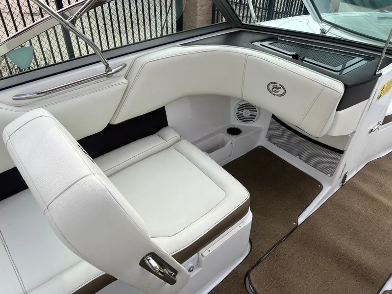 Slide: The Image of Interior of a 2017 Cobalt 220S boat with white leather seating. - 15