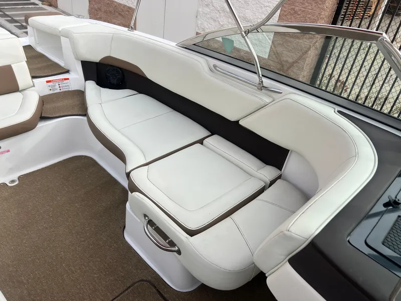 Slide: The Image of 2017 Cobalt 220S boat interior with white and brown leather seating. - 19