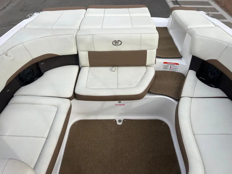 Slide: The Image of 2017 Cobalt 220S boat interior with white and brown seating. - 21