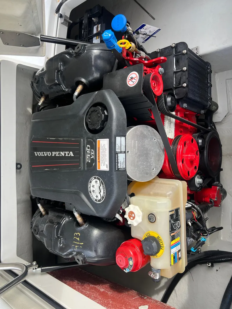 Slide: The Image of 2017 Cobalt 220S boat engine compartment with Volvo Penta engine. - 22