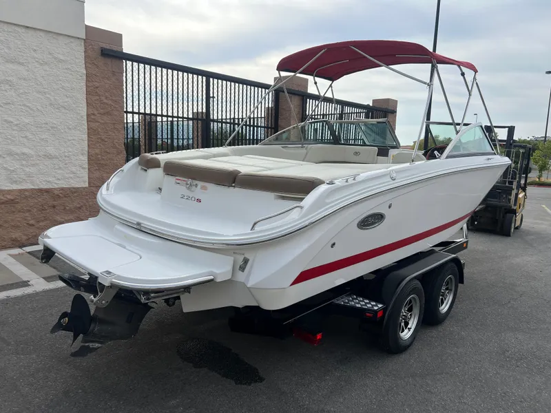 Slide: The Image of 2017 Cobalt 220S boat with red accents on a trailer. - 3