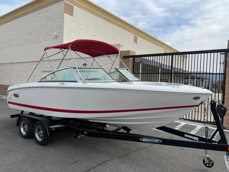 Slide: The Image of 2017 Cobalt 220S boat with red canopy on trailer. - 8