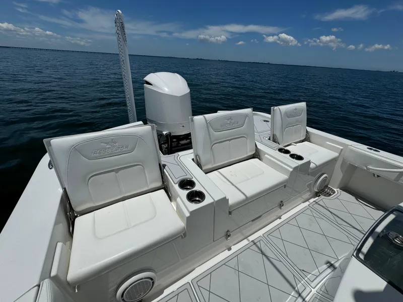 Slide: The Image of 2020 Regulator 26XO boat with white seating and ocean backdrop. - 15