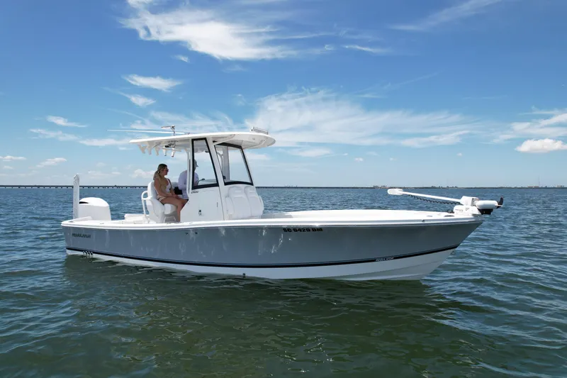 Slide: The Image of 2020 Regulator 26XO boat on open water under clear blue sky. - 2