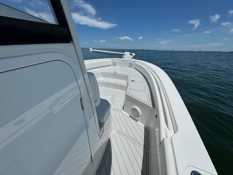 Slide: The Image of 2020 Regulator 26XO boat on open water under clear blue sky. - 21