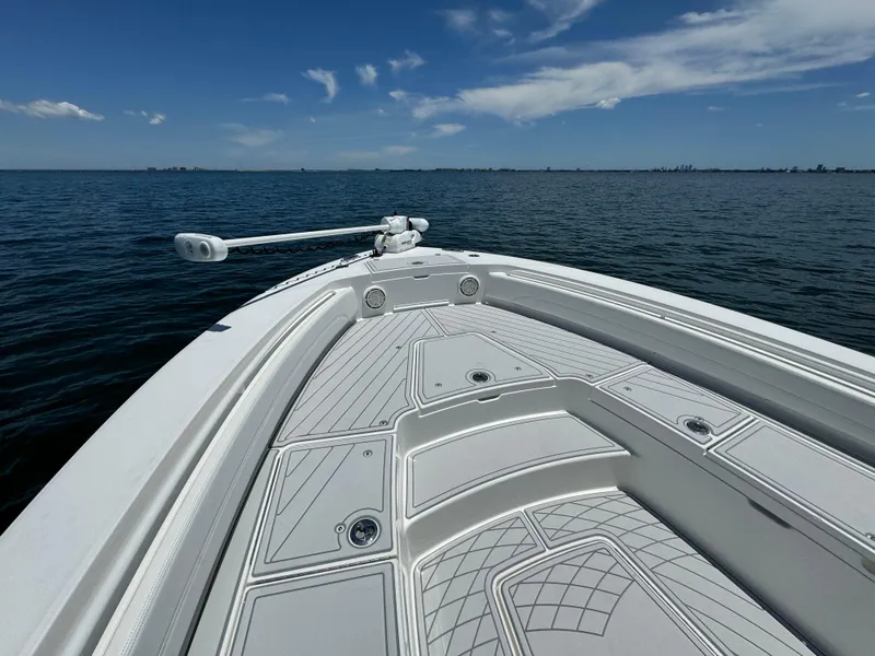 Slide: The Image of 2020 Regulator 26XO boat on calm ocean waters under a clear blue sky. - 27