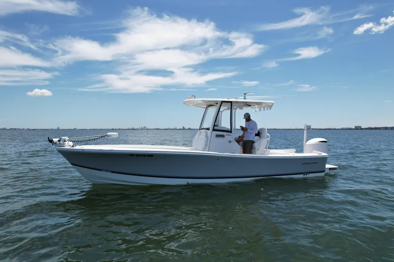 Slide: The Image of 2020 Regulator 26XO boat on calm water with clear blue sky. - 4