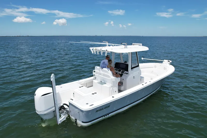 Slide: The Image of 2020 Regulator 26XO boat cruising on open water. - 6