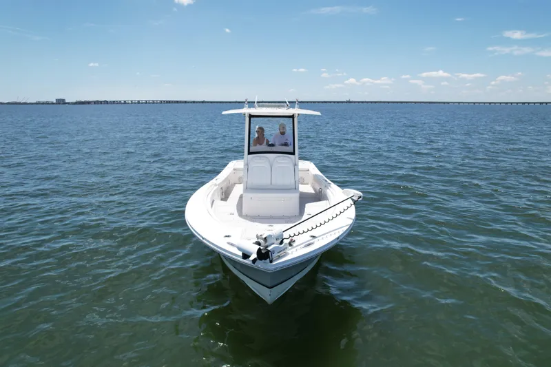 Slide: The Image of 2020 Regulator 26XO boat on open water under clear sky. - 7