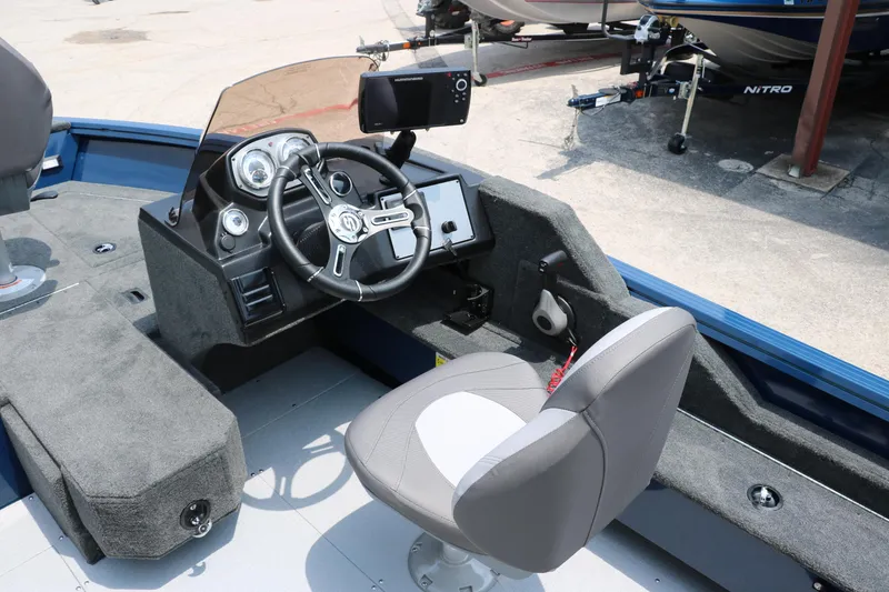 Slide: The Image of 2024 Smoker Craft Excursion Pro 176 SC Pro boat cockpit with steering wheel and control panel. - 23