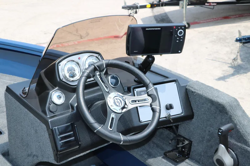 Slide: The Image of 2024 Smoker Craft Excursion Pro 176 SC Pro dashboard with steering wheel and fish finder. - 24