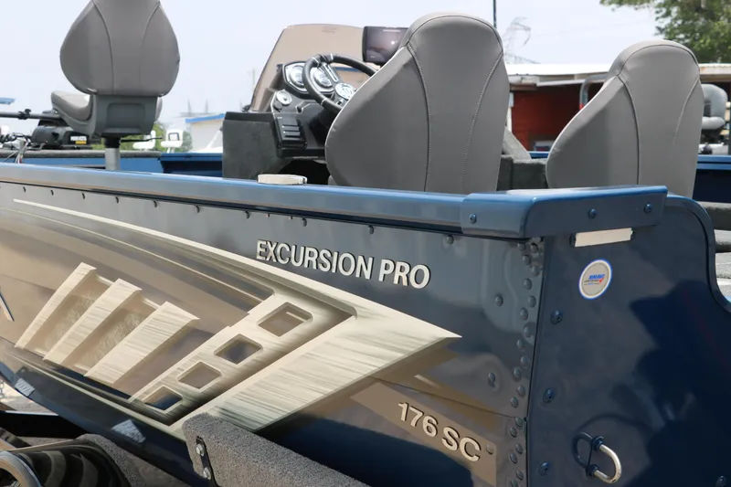 Slide: The Image of 2024 Smoker Craft Excursion Pro 176 SC Pro boat interior and side view. - 6