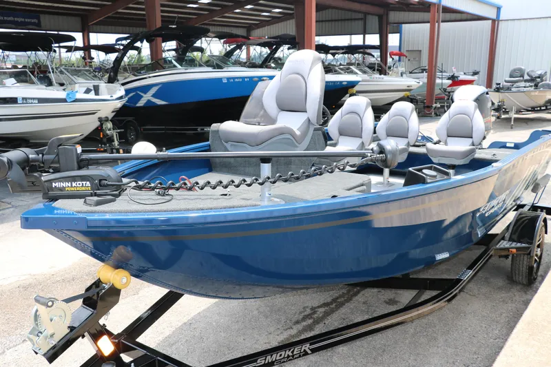 Slide: The Image of 2024 Smoker Craft Excursion Pro 176 SC Pro fishing boat in blue, equipped with Minn Kota trolling motor. - 8