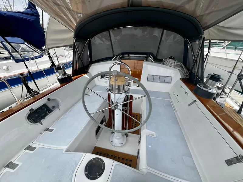 Slide: The Image of Cockpit of 1987 Norseman 400 sailboat with steering wheel and canopy. - 11