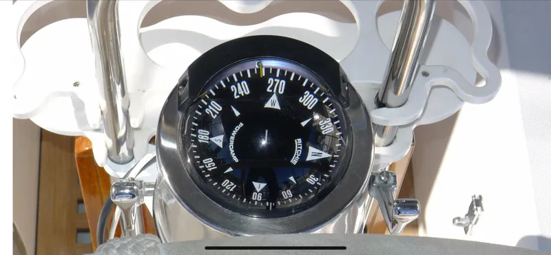 Slide: The Image of Compass on Norseman 400 yacht, 1987 model, showing direction in nautical setting. - 19