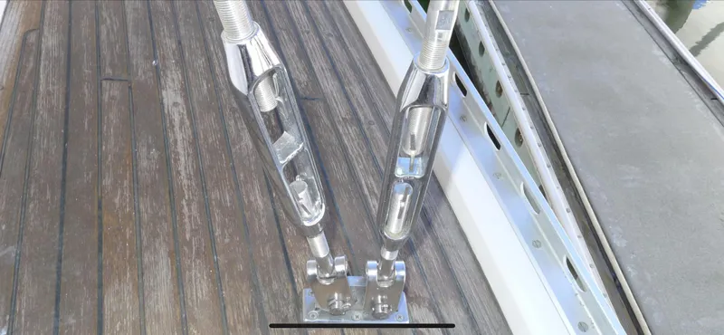 Slide: The Image of Close-up of Norseman 400 yacht rigging hardware on wooden deck, 1987 model. - 23