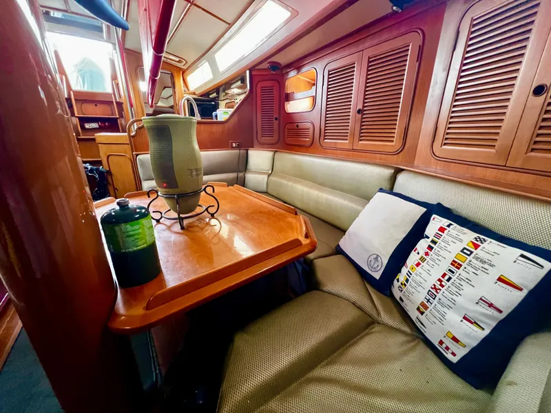 Slide: The Image of Interior of 1987 Norseman 400 yacht with wooden finishes and cozy seating area. - 30