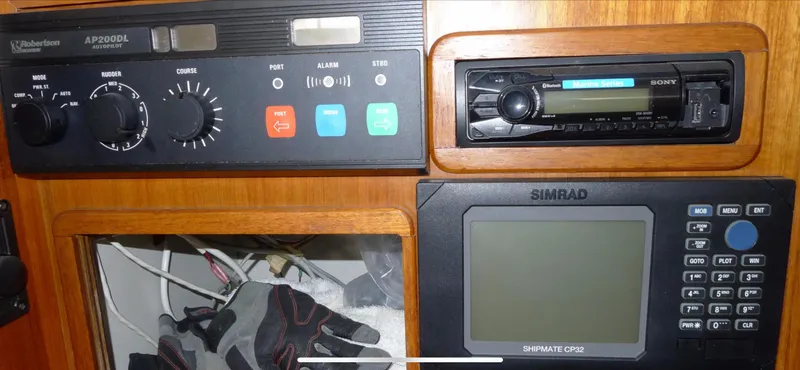 Slide: The Image of Control panel of a 1987 Norseman 400 with navigation and communication equipment. - 38