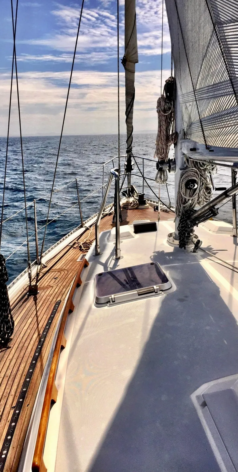 Slide: The Image of Sailing on a 1987 Norseman 400 yacht, open sea view, clear skies. - 5