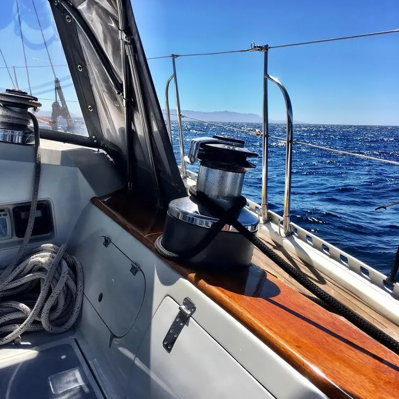 Slide: The Image of Sailing on a 1987 Norseman 400 yacht, featuring a winch and ocean view. - 7
