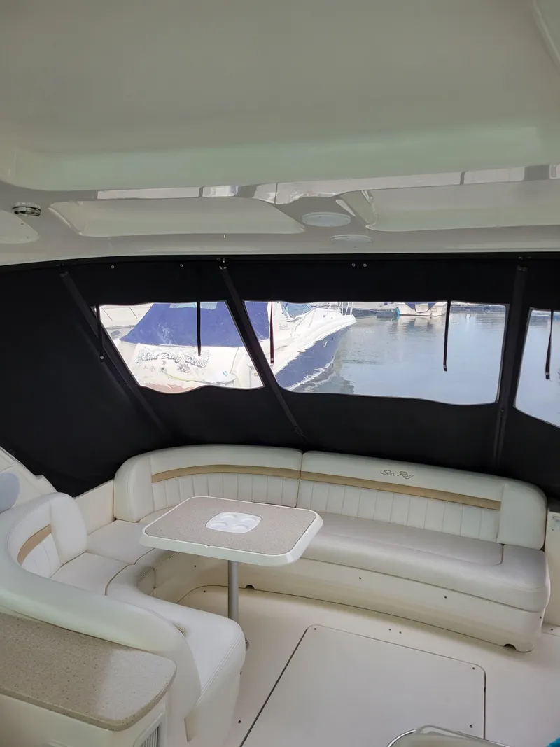Slide: The Image of Interior of 2009 Sea Ray 500 Sundancer yacht with seating and table. - 12