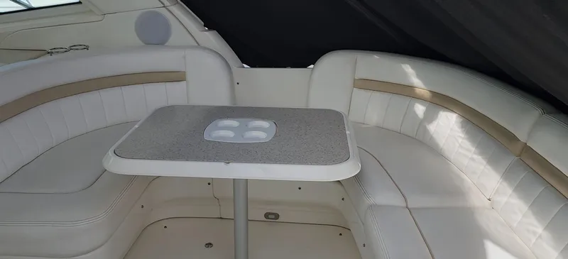 Slide: The Image of Interior seating area of 2009 Sea Ray 500 Sundancer yacht with table. - 20