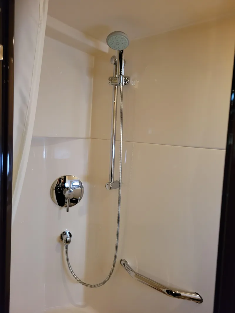 Slide: The Image of Shower area in 2009 Sea Ray 500 Sundancer yacht, featuring modern fixtures and sleek design. - 31