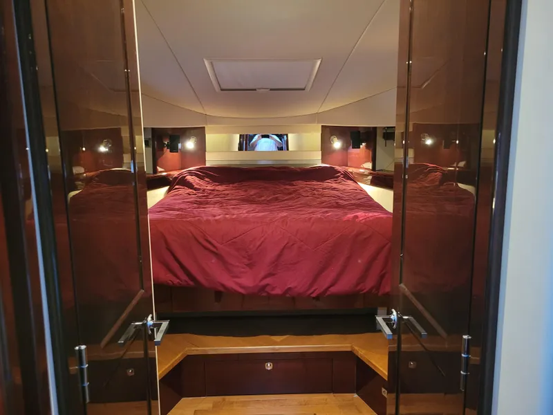 Slide: The Image of Luxurious bedroom interior of 2009 Sea Ray 500 Sundancer yacht with red bedding. - 35