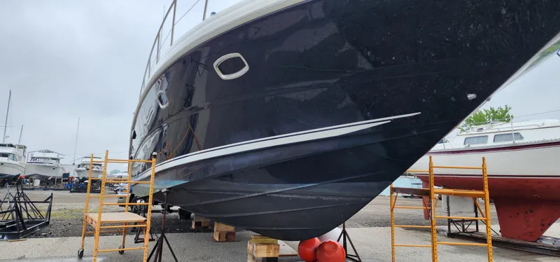 Slide: The Image of 2009 Sea Ray 500 Sundancer yacht on dry dock, side view with scaffolding. - 6