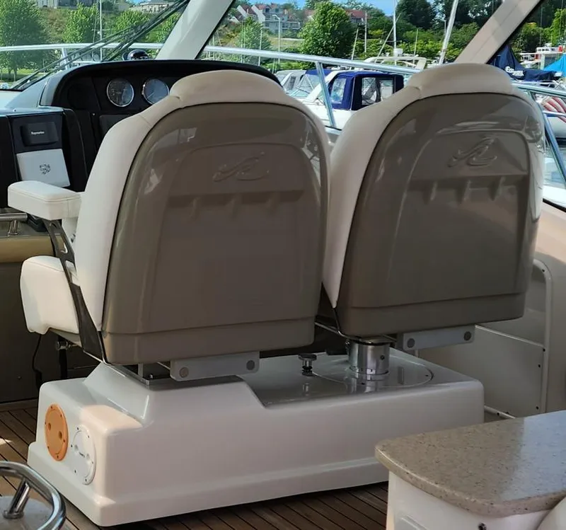 Slide: The Image of 2009 Sea Ray 500 Sundancer helm seats with dashboard view. - 21
