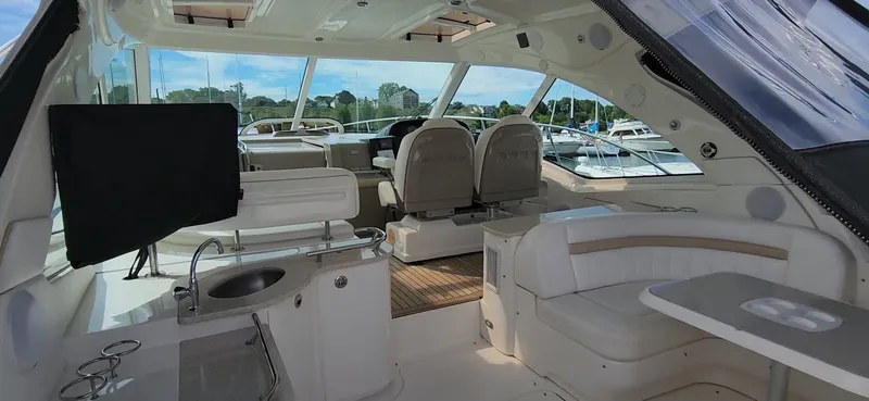 Slide: The Image of Interior of 2009 Sea Ray 500 Sundancer yacht with seating and helm. - 22