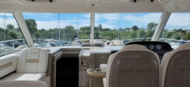 Slide: The Image of Interior view of 2009 Sea Ray 500 Sundancer yacht with luxurious seating and dashboard. - 23