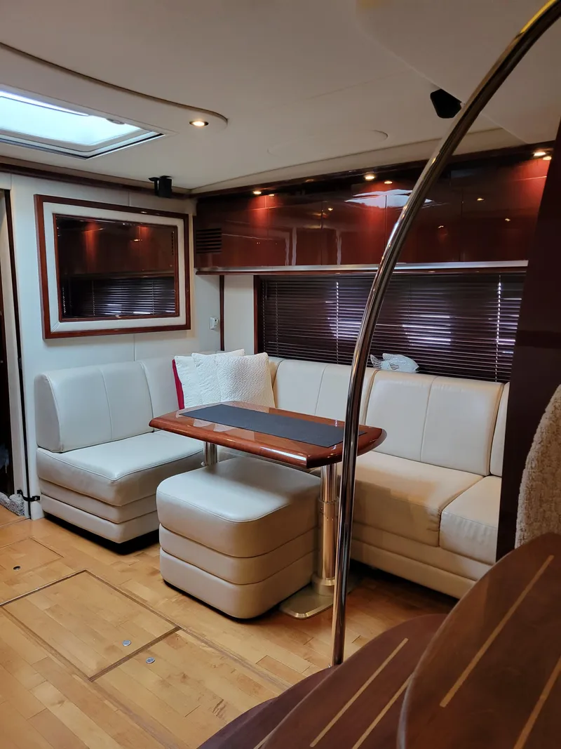 Slide: The Image of Luxurious interior of 2009 Sea Ray 500 Sundancer yacht with elegant seating and wooden accents. - 25