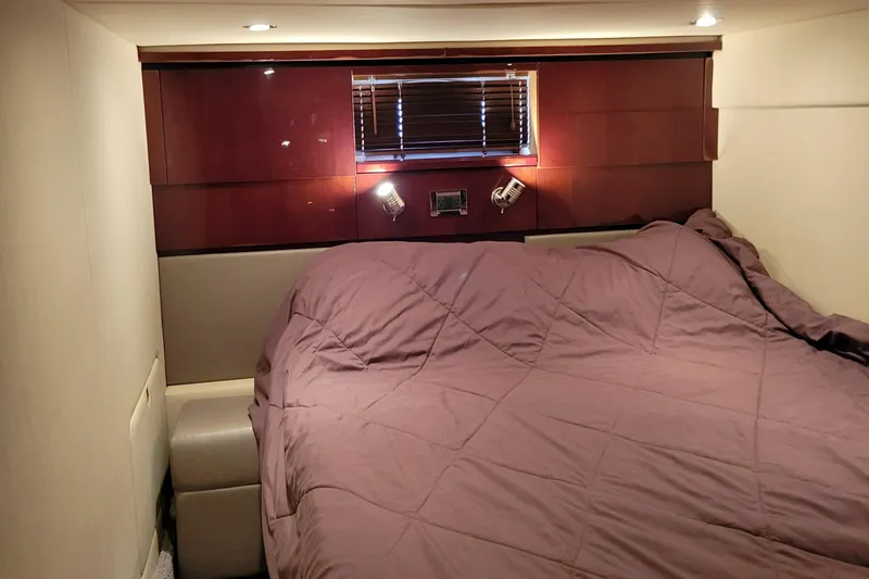 Slide: The Image of Luxurious bedroom interior of 2009 Sea Ray 500 Sundancer yacht with cozy bedding. - 37