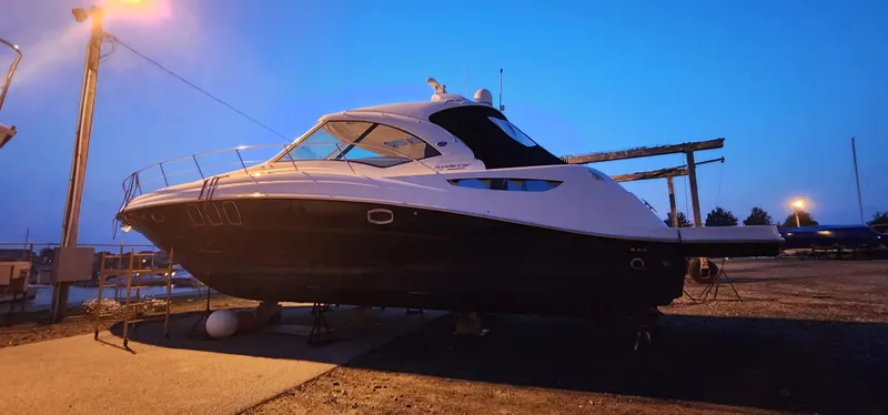 Slide: The Image of 2009 Sea Ray 500 Sundancer yacht on dry dock at dusk. - 5