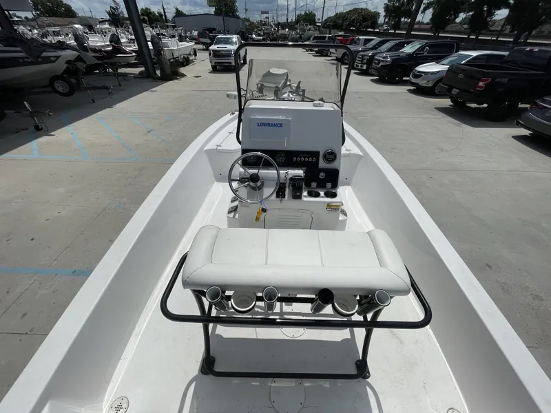 Slide: The Image of 2020 Blazer boat model at a dealership, featuring a Lowrance navigation system and white seating. - 16
