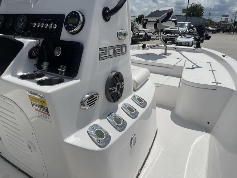 Slide: The Image of Control panel of a 2020 Blazer boat, model year 2021, with cup holders and seating. - 18