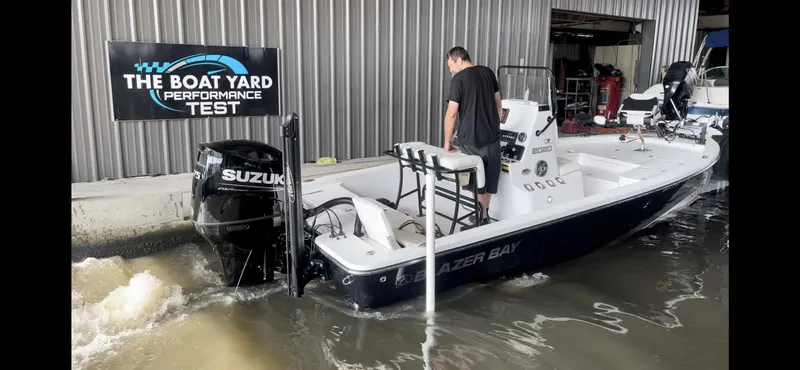 Slide: The Image of Blazer Bay 2020 boat undergoing performance test at The Boat Yard, powered by Suzuki engine. - 19