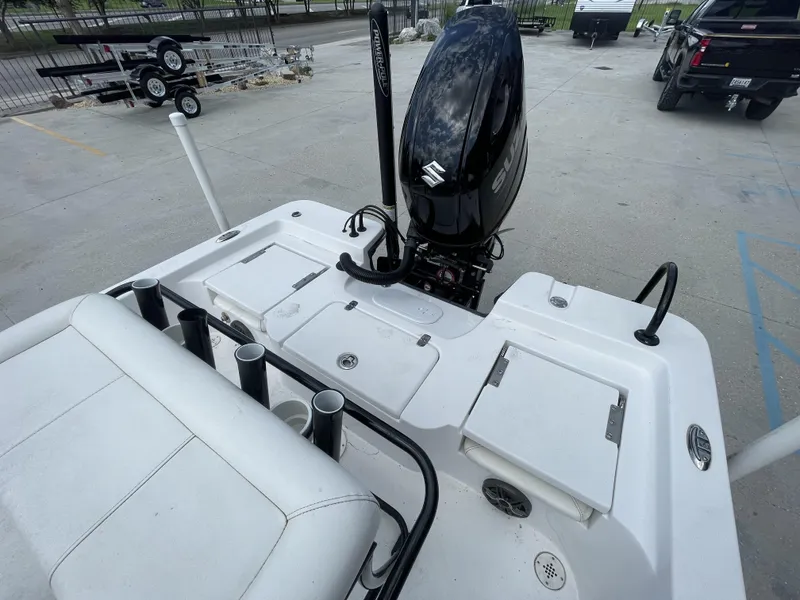 Slide: The Image of 2020 Blazer boat with Suzuki outboard motor and rod holders, rear view. - 28