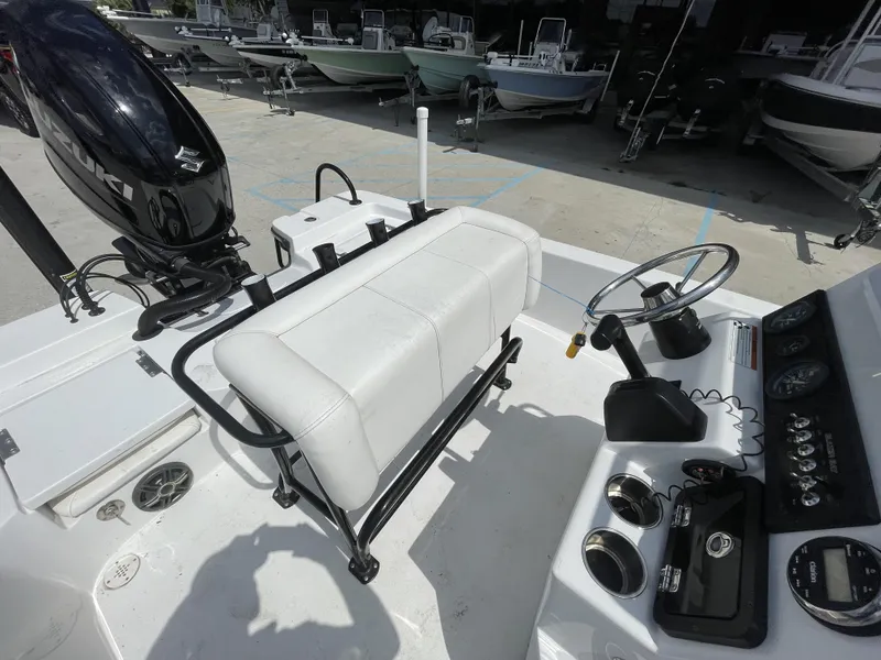 Slide: The Image of 2020 Blazer boat interior with Suzuki outboard motor and steering console. - 29