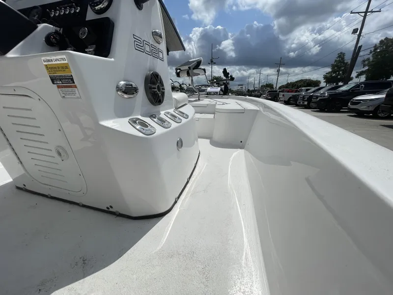 Slide: The Image of Interior view of a 2020 Blazer boat model, showcasing the control panel and seating area. - 32