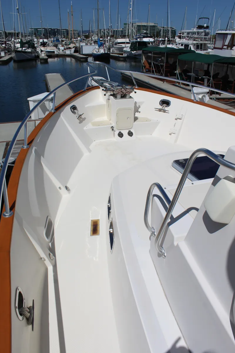 Slide: The Image of Deck of a 1999 Cherubini Independence 50 boat in harbor. - 12
