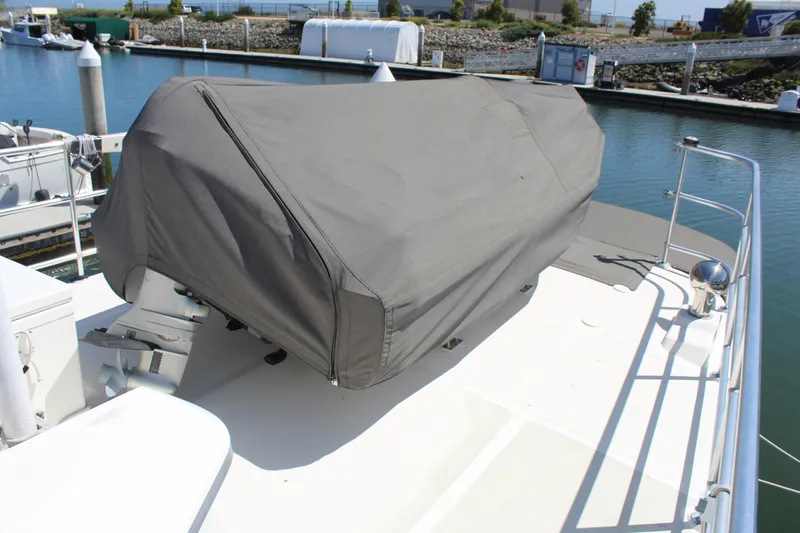 Slide: The Image of Covered deck of a 1999 Cherubini Independence 50 at the marina. - 13