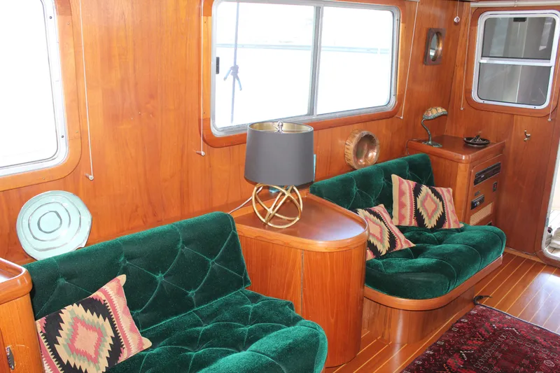 Slide: The Image of Interior of 1999 Cherubini Independence 50 yacht with green velvet sofas. - 40