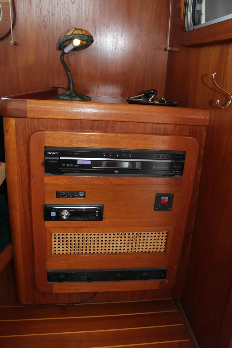 Slide: The Image of Interior of 1999 Cherubini Independence 50 with wood paneling and electronics. - 41
