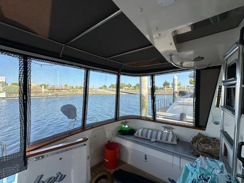 Slide: The Image of Interior view of 1999 Cherubini Independence 50 yacht by the water. - 5