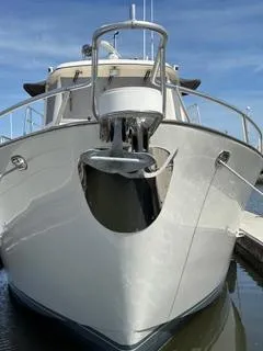 Slide: The Image of Front view of 1999 Cherubini Independence 50 yacht docked. - 9