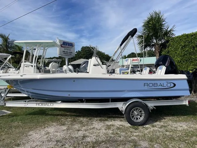 The Image of 2024 Robalo 206 Cayman boat on a trailer, displayed outdoors. - 1