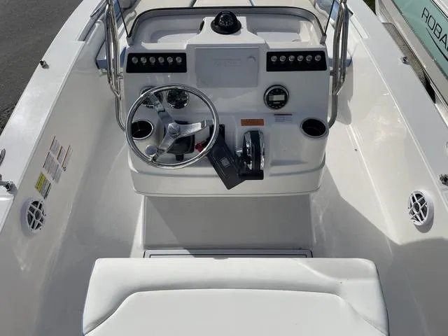 Slide: The Image of 2024 Robalo 206 Cayman boat console with steering wheel and controls. - 12